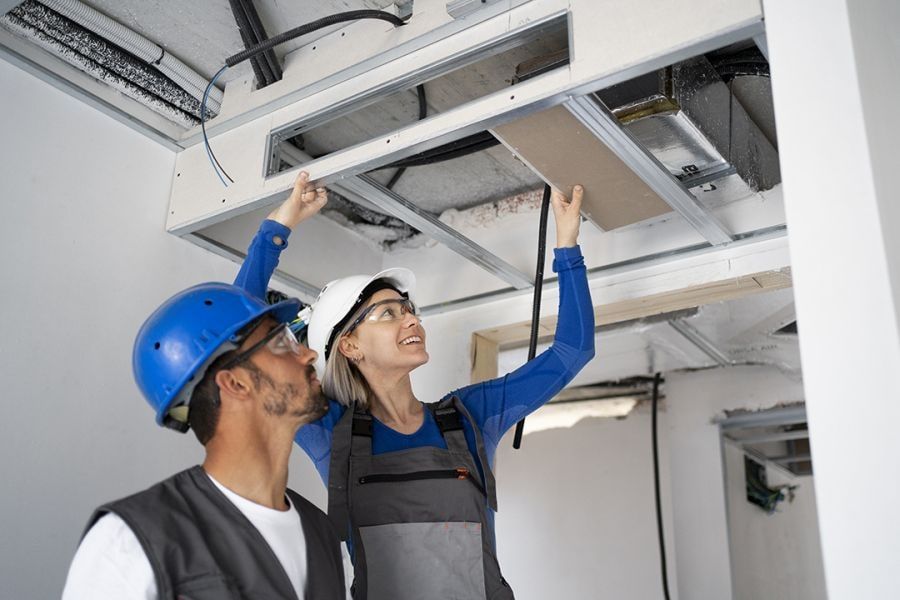 HVAC Technicians wearing helmets at work